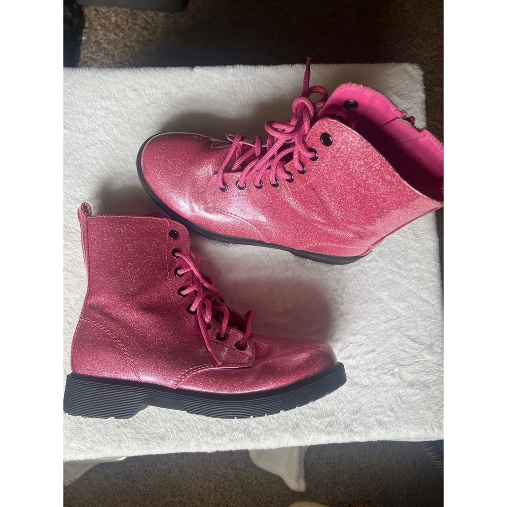 68.-   Pink glittery lace up boots